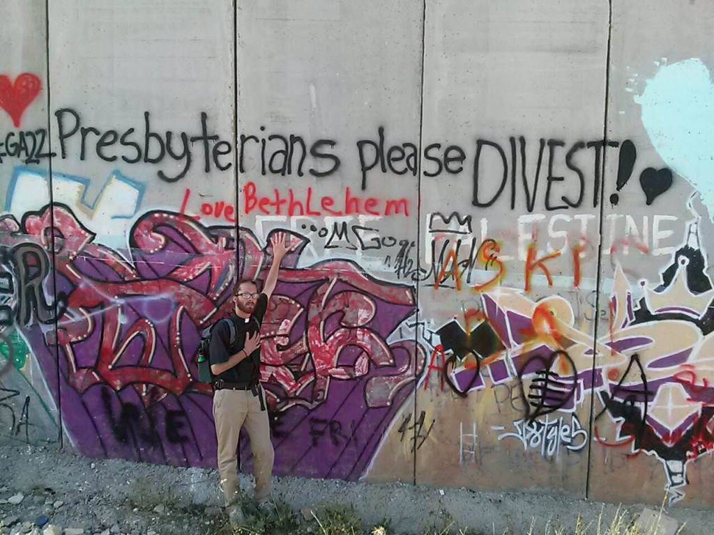 Rev. Chad Collins at the Separation Wall in Bethlehem during the 221st Presbyterian General Assembly