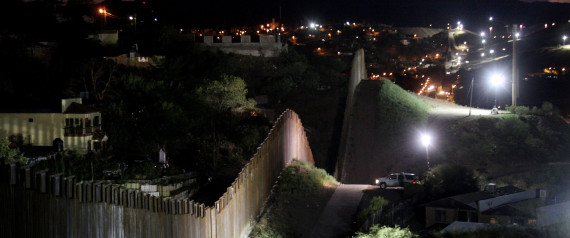 NOGALES, AZ - JULY 6: The border wall is illuminated at night July 6, 2012 in Nogales, Arizona. The president-elect of Mexico, Enrique Peña Nieto, stated that he wants to expand his country's drug-war partnership with the United States but that he would not support the presence of armed American agents in Mexico. (Photo by Sandy Huffaker/Getty Images)